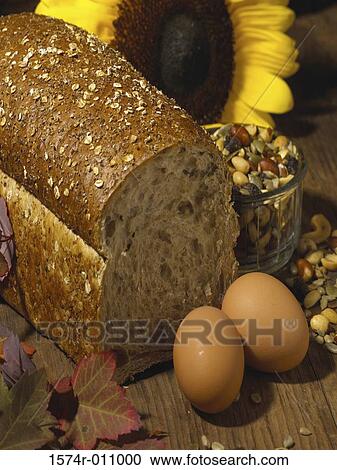 Stock Image - Close-up of eggs and brown bread. Fotosearch