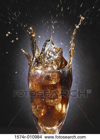 Close-up of ice falling into a glass View Large Photo Image Picture - Close-up of ice falling into a glass. Fotosearch