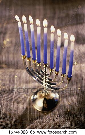 Close-up of lit candles on a menorah View Large Photo Image Stock Image - Close-up of lit candles on a menorah. Fotosearch