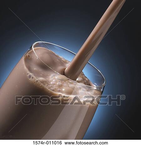 Close-up of milkshake being poured into a glass View Large Photo Image Stock Photograph - Close-up of milkshake being poured into a glass. Fotosearch