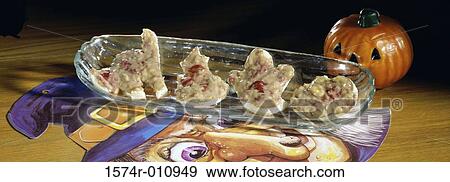 Stock Photo - Cookies on a platter with a Halloween pumpkin. Fotosearch