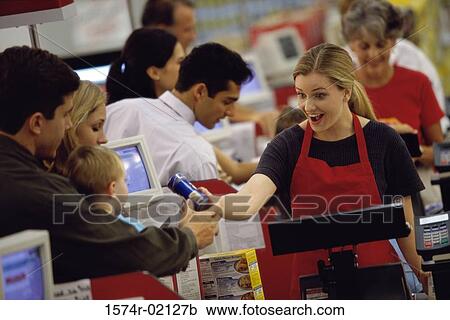 Customers standing at a checkout counter in a supermarket View Large Photo Image Stock Image - Customers standing at a checkout counter in a supermarket. Fotosearch