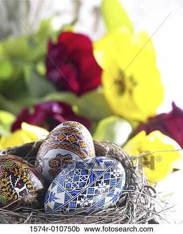 Stock Image - Decorated Easter eggs in a nest. Fotosearch
