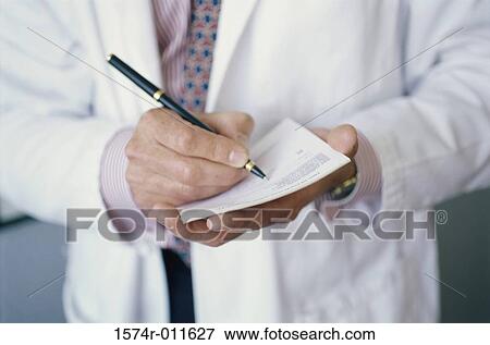 Doctor writing a prescription View Large Photo Image Stock Photo - Doctor writing a prescription. Fotosearch