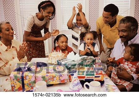 Family celebrating a birthday party View Large Photo Image Stock Image - Family celebrating a birthday party. Fotosearch
