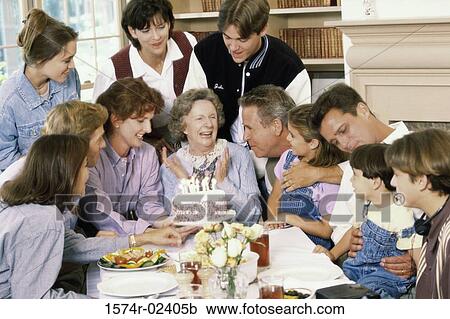 Stock Image - Family celebrating a birthday party. Fotosearch