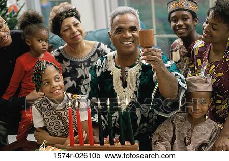 Stock Image - Family celebrating Kwanzaa. Fotosearch