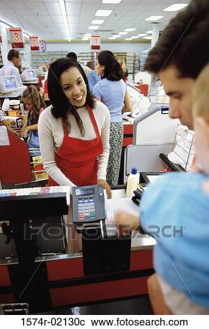 Father and his son at a checkout counter in a supermarket View Large Photo Image Stock Image - Father and his son at a checkout counter in a supermarket. Fotosearch