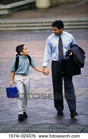 Father and his son holding hands View Large Photo Image Stock Image - Father and his son holding hands. Fotosearch
