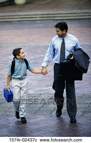 Father and his son holding hands View Large Photo Image Stock Image - Father and his son holding hands. Fotosearch