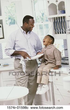 Father and son looking at each other View Large Photo Image Stock Image - Father and son looking at each other. Fotosearch