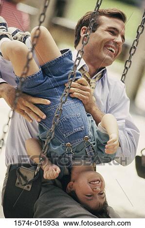 Father and son on a playground View Large Photo Image Stock Image - Father and son on a playground. Fotosearch