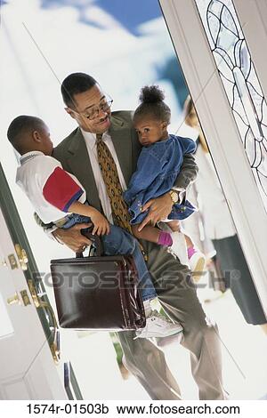 Father carrying his son and daughter View Large Photo Image Stock Image - Father carrying his son and daughter. Fotosearch