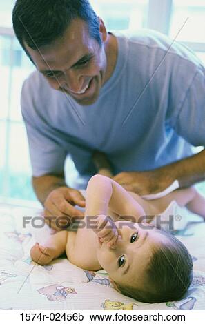 Father looking at his baby boy View Large Photo Image Stock Image - Father looking at his baby boy. Fotosearch