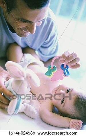 Father playing with his baby boy View Large Photo Image Stock Image - Father playing with his baby boy. Fotosearch