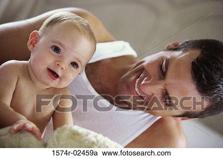 Father playing with his baby boy View Large Photo Image Stock Image - Father playing with his baby boy. Fotosearch