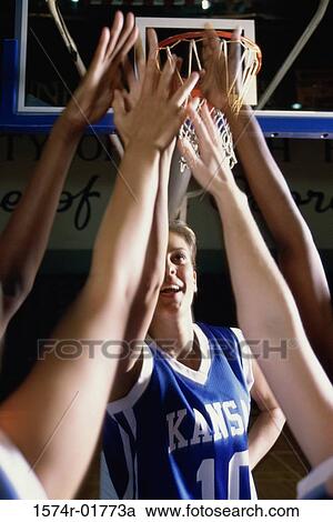 Female basketball players reaching upwards View Large Photo Image Stock Image - Female basketball players reaching upwards. Fotosearch