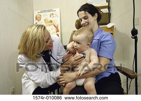 Female doctor examining a baby boy View Large Photo Image Stock Photograph - Female doctor examining a baby boy. Fotosearch