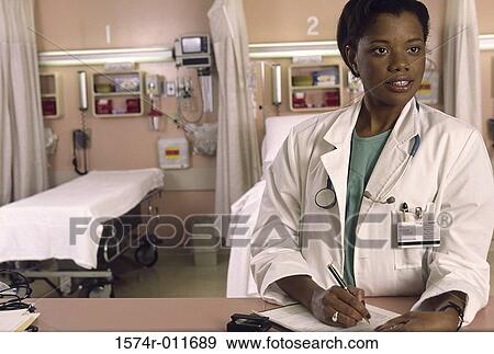 Stock Photo - Female doctor looking away. Fotosearch
