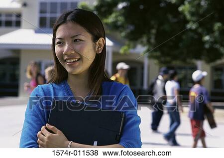 Female student holding books View Large Photo Image Stock Photo - Female student holding books. Fotosearch