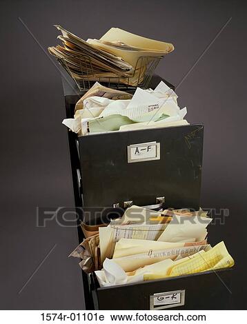 Stock Image - Filing cabinet with an open drawer. Fotosearch