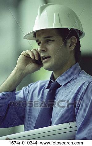 Picture - Foreman talking on a mobile phone. Fotosearch