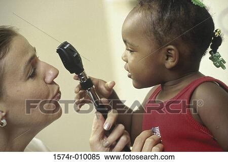 Stock Photography - Girl holding a medical scope. Fotosearch