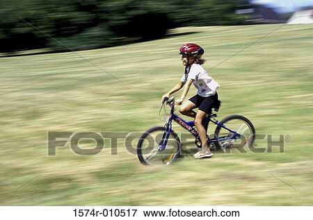 Stock Photo - Girl riding a bicycle. Fotosearch