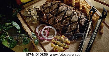 Grilled meat View Large Photo Image Stock Photo - Grilled meat. Fotosearch