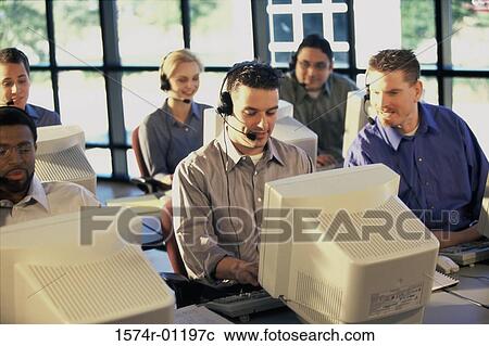 Group of business executives working on computers View Large Photo Image Stock Image - Group of business executives working on computers. Fotosearch