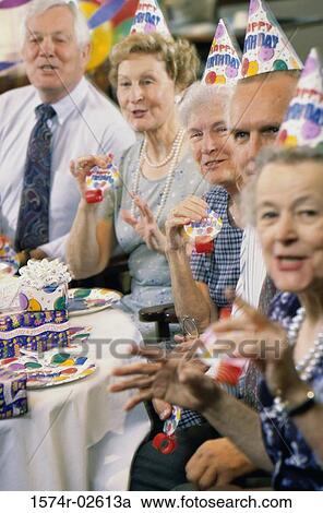 Group of senior people celebrating at a birthday party View Large Photo Image Stock Image - Group of senior people celebrating at a birthday party. Fotosearch