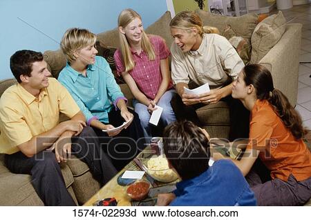 Group of teenagers having a group discussion View Large Photo Image Stock Image - Group of teenagers having a group discussion. Fotosearch