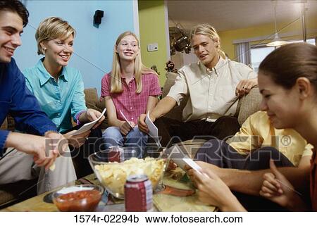 Group of teenagers having a group discussion View Large Photo Image Stock Image - Group of teenagers having a group discussion. Fotosearch