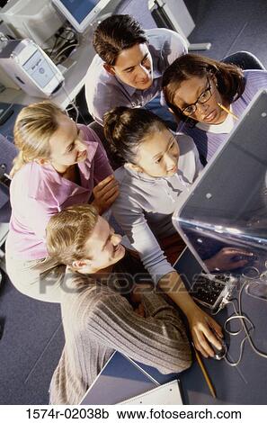 Group of young people in front of a computer monitor View Large Photo Image Stock Image - Group of young people in front of a computer monitor. Fotosearch