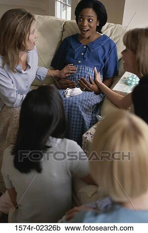 Group of young women sitting together at a baby shower View Large Photo Image Stock Image - Group of young women sitting together at a baby shower. Fotosearch