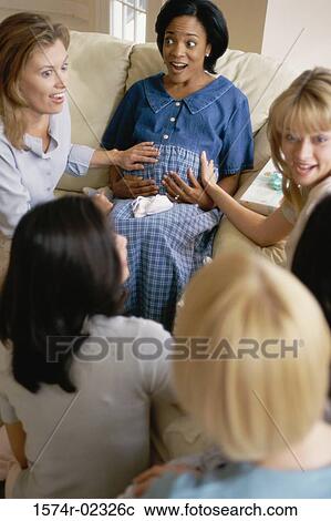 Group of young women sitting together at a baby shower View Large Photo Image Stock Image - Group of young women sitting together at a baby shower. Fotosearch