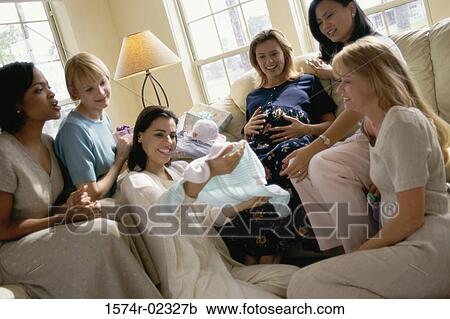 Group of young women sitting together at a baby shower View Large Photo Image Stock Image - Group of young women sitting together at a baby shower. Fotosearch