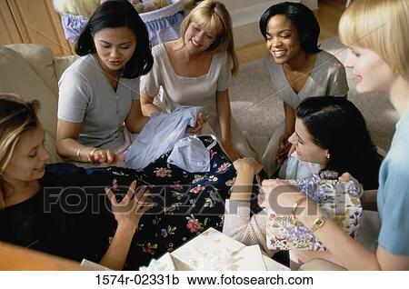 Group of young women sitting together at a baby shower View Large Photo Image Stock Image - Group of young women sitting together at a baby shower. Fotosearch