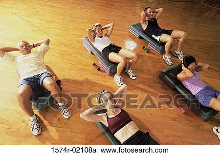 High angle view of a group of people exercising in a step aerobics class View Large Photo Image Stock Image - High angle view of a group of people exercising in a step aerobics class. Fotosearch
