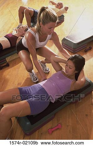 High angle view of a group of people exercising in a step aerobics class View Large Photo Image Stock Image - High angle view of a group of people exercising in a step aerobics class. Fotosearch