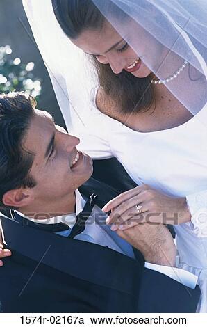 High angle view of a newlywed couple looking at each other View Large Photo Image Stock Image - High angle view of a newlywed couple looking at each other. Fotosearch