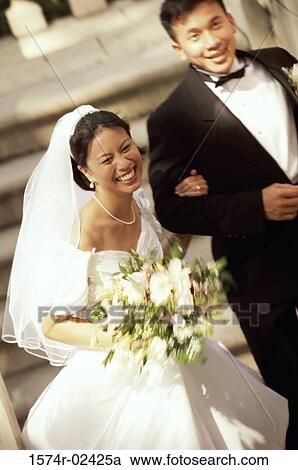 Stock Image - High angle view of a newlywed couple. Fotosearch