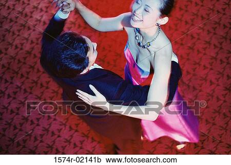 High angle view of a young couple dancing in a nightclub View Large Photo Image Stock Image - High angle view of a young couple dancing in a nightclub. Fotosearch