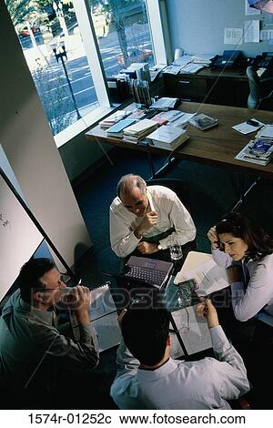 Stock Image - High angle view of business executives in a meeting. Fotosearch