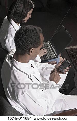 High angle view of two doctors View Large Photo Image Picture - High angle view of two doctors. Fotosearch
