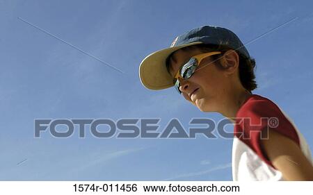 Low angle view of a boy View Large Photo Image Stock Photograph - Low angle view of a boy. Fotosearch