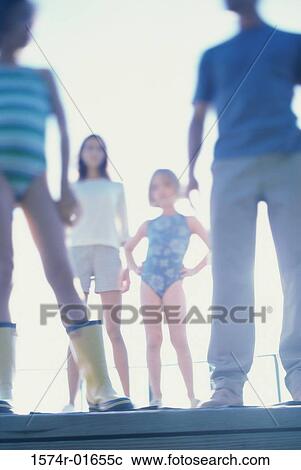 Low angle view of parents with their two daughters View Large Photo Image Stock Image - Low angle view of parents with their two daughters. Fotosearch
