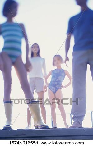 Low angle view of parents with their two daughters View Large Photo Image Stock Image - Low angle view of parents with their two daughters. Fotosearch
