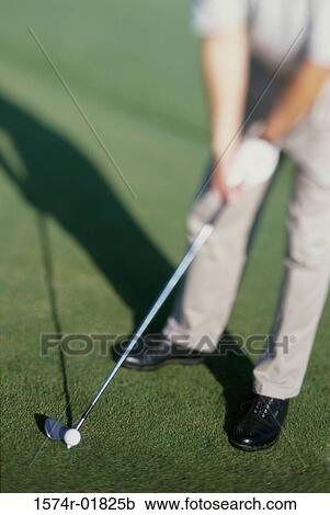 Stock Image - Low section view of a man playing golf. Fotosearch