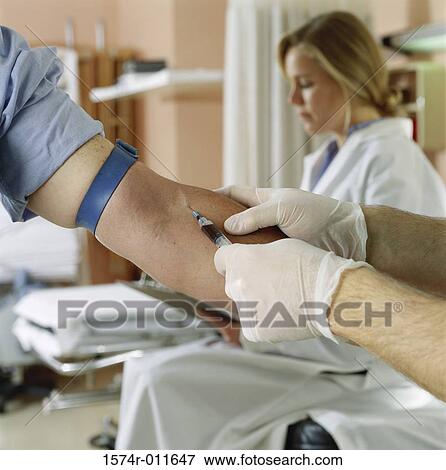 Male doctor taking a blood sample View Large Photo Image Stock Photo - Male doctor taking a blood sample. Fotosearch